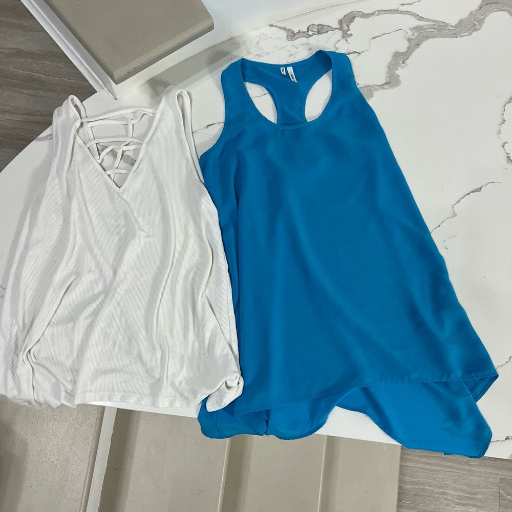 ⭐️ Two Women’s Tanks.  White one American Eagle, Blue is Maurice’s. Size Small.